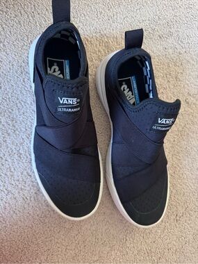 Vans Ultrarange Slip-On Sneakers in Black and White